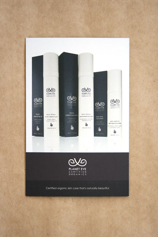 Planet Eve promotional postcard printed on uncoated stock and photographed on kraft paper
